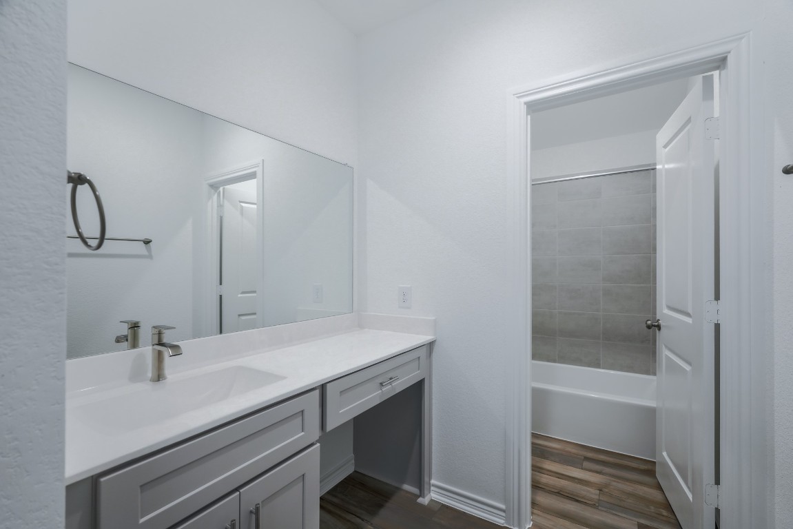 15135 Wild Gully Way Conroe, TX 77302 - Photo 30 of 42 a bathroom with a sink and a mirror