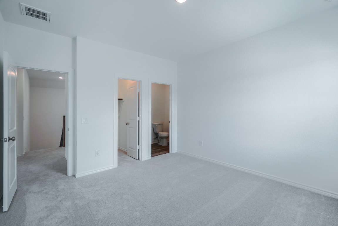 15135 Wild Gully Way Conroe, TX 77302 - Photo 33 of 42 an empty room with closet area