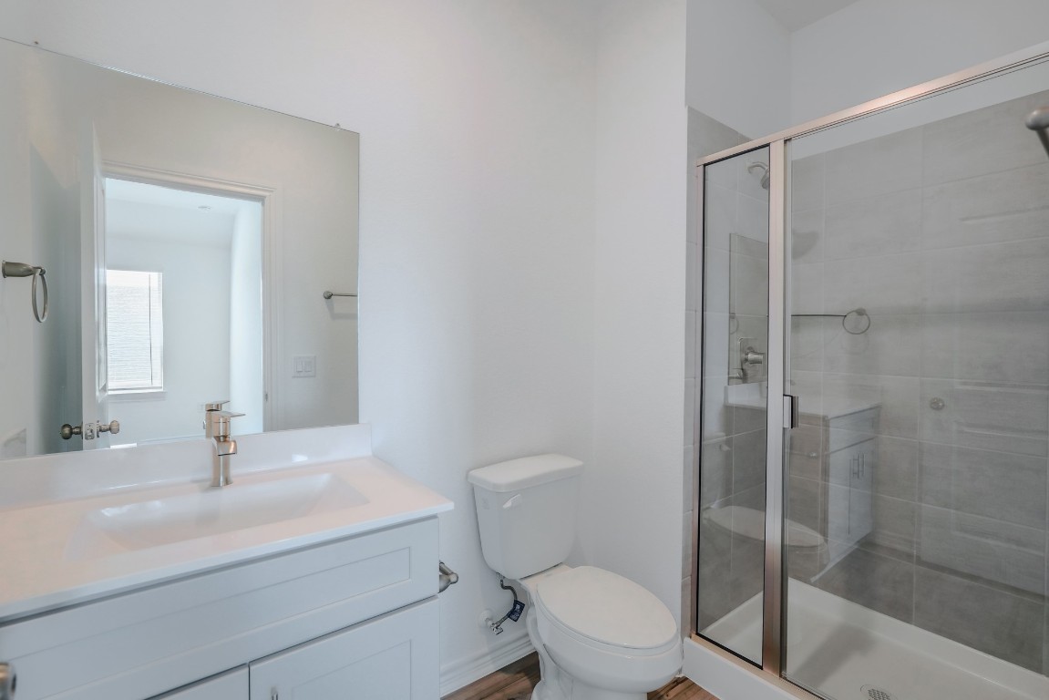 15135 Wild Gully Way Conroe, TX 77302 - Photo 34 of 42 a bathroom with a sink a toilet and shower