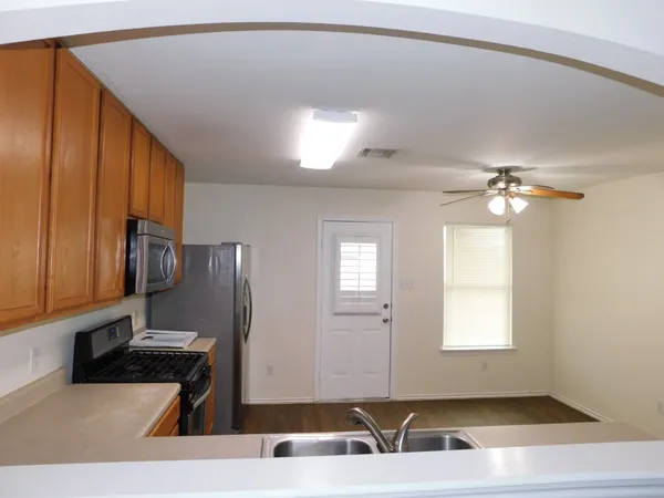a view of a livingroom with furniture and windows