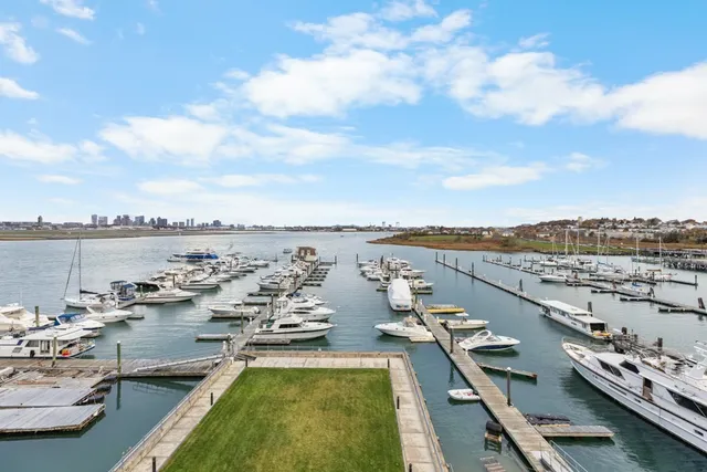a view of a terrace with lawn chairs