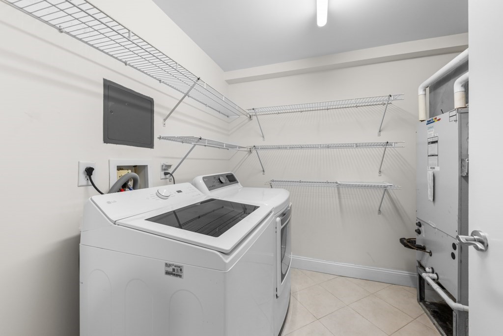 550 Pleasant Street, Unit 506 Winthrop, MA 02152 - Photo 17 of 21 a utility room with dryer and washer