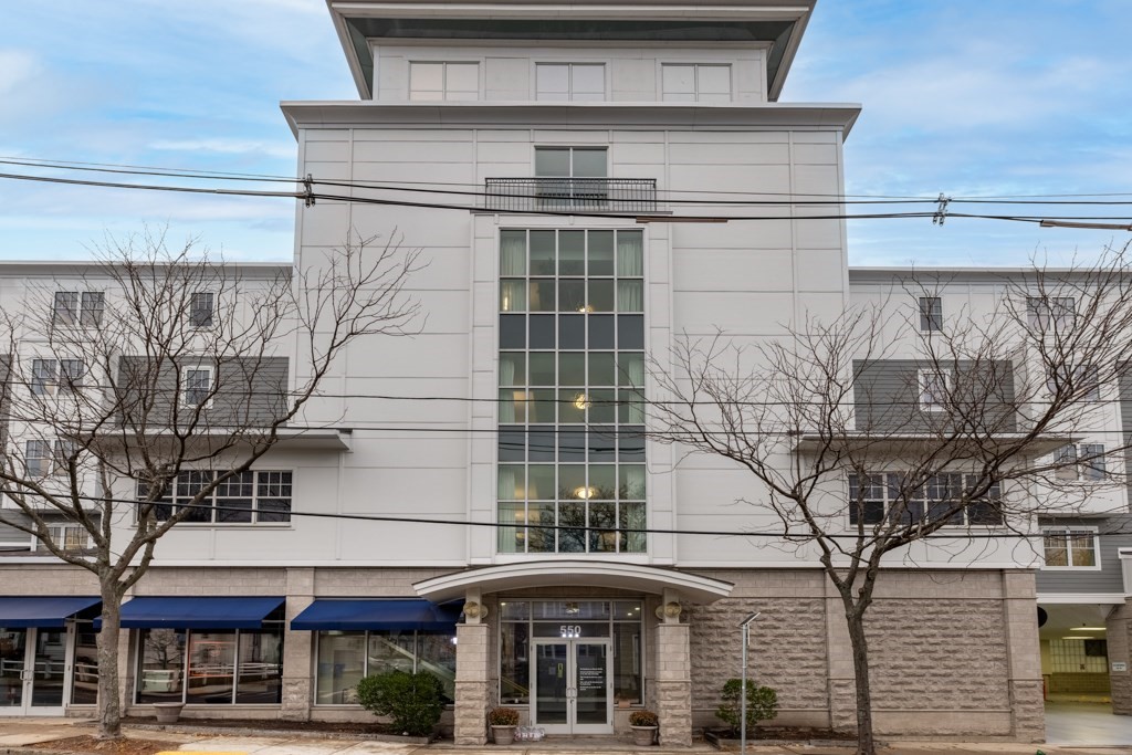 550 Pleasant Street, Unit 506 Winthrop, MA 02152 - Photo 20 of 21 a front view of a building with a lot of windows