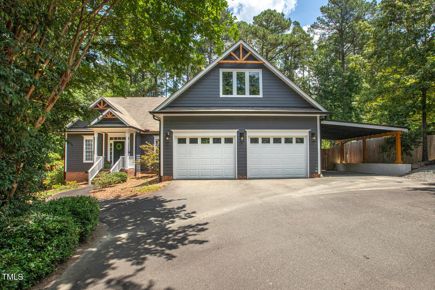 5809 Garrett Road Durham, NC 27707 - Photo 1 of 66 a front view of a house with a yard and garage