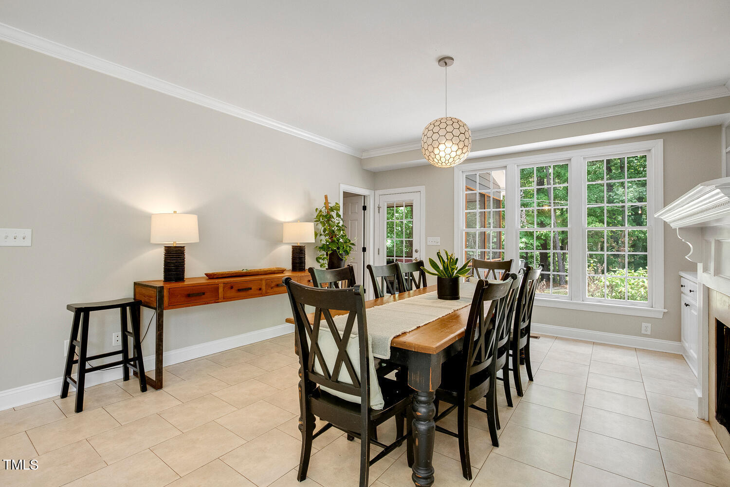 5809 Garrett Road Durham, NC 27707 - Photo 20 of 66 a view of a dining room with furniture window and outside view