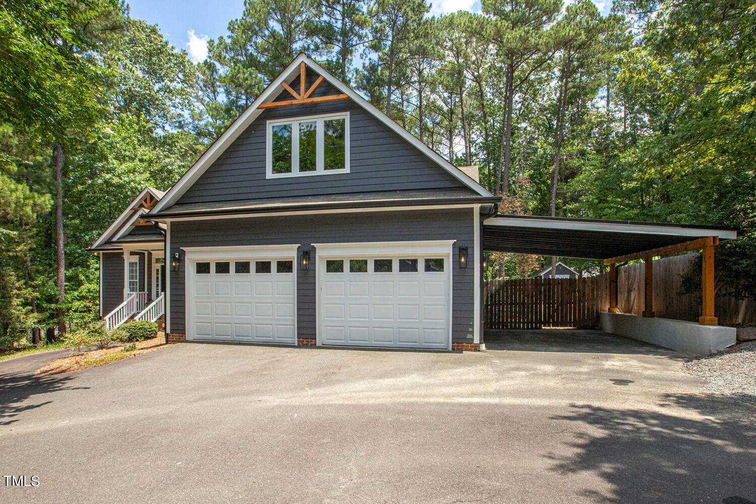 5809 Garrett Road Durham, NC 27707 - Photo 2 of 66 a front view of a house with a yard and garage