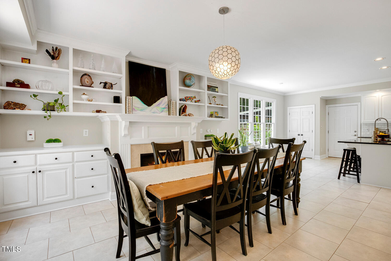 5809 Garrett Road Durham, NC 27707 - Photo 22 of 66 a view of a dining room with furniture and chandelier