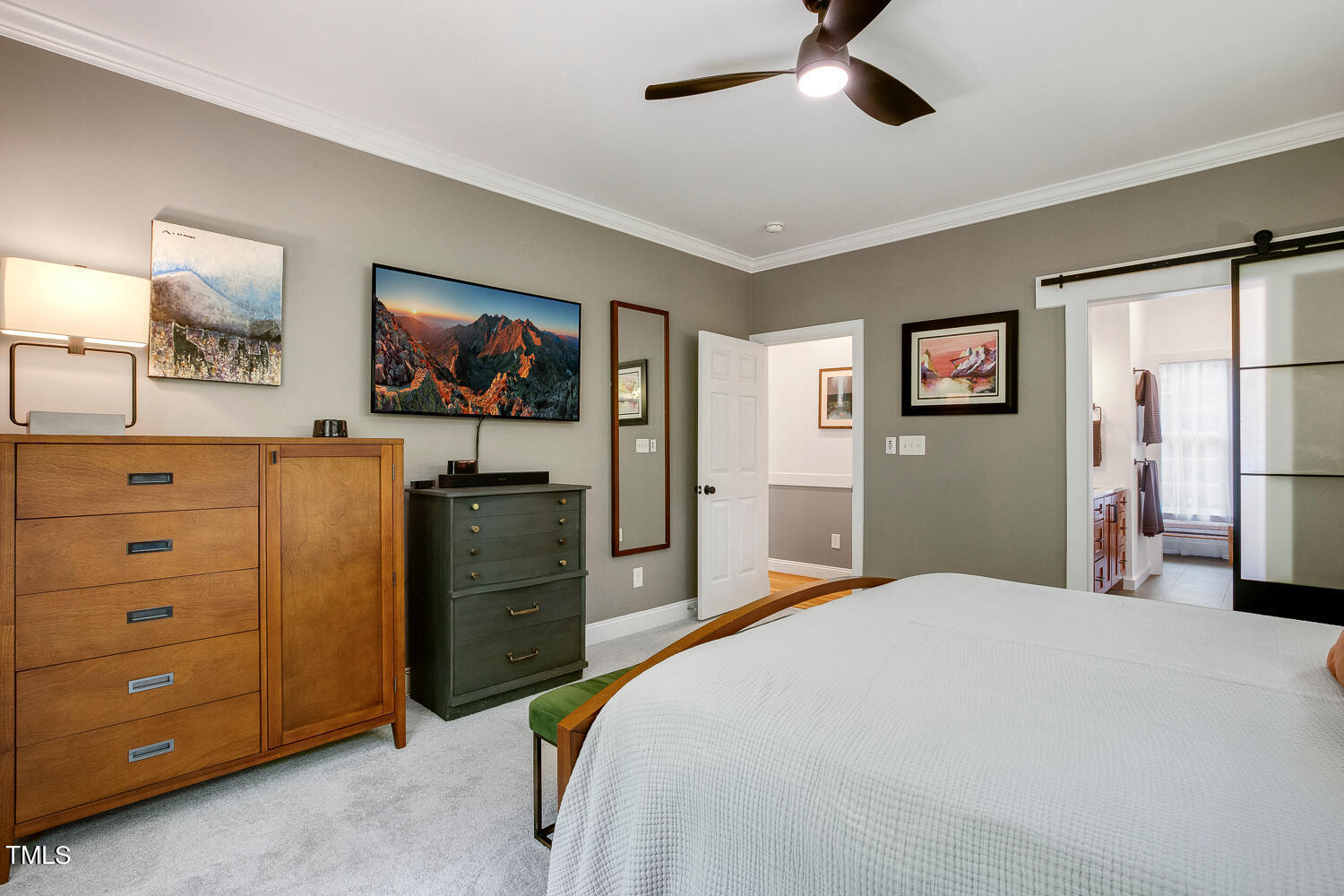 5809 Garrett Road Durham, NC 27707 - Photo 25 of 66 a bedroom with a bed and a dresser