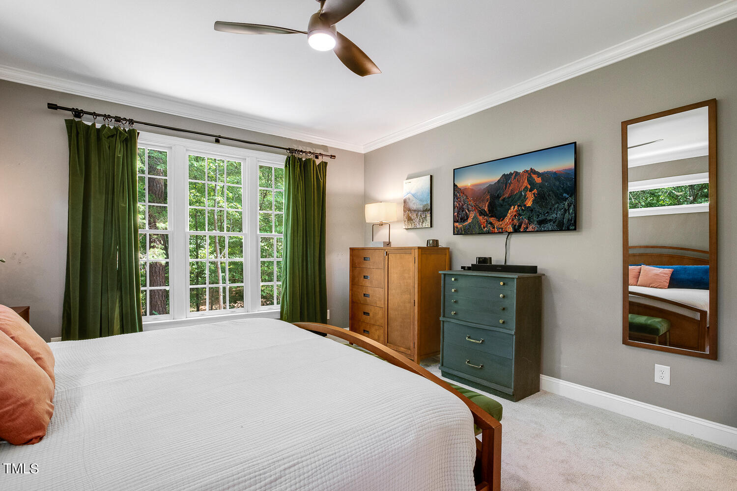 5809 Garrett Road Durham, NC 27707 - Photo 26 of 66 a bedroom with a bed and a flat screen tv