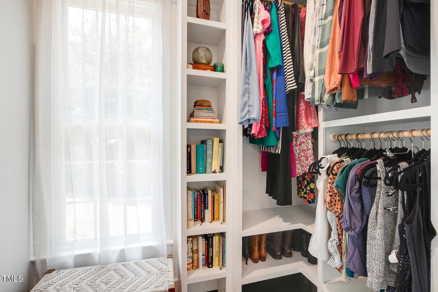 5809 Garrett Road Durham, NC 27707 - Photo 29 of 66 a view of walk in closet with clothes and shoes