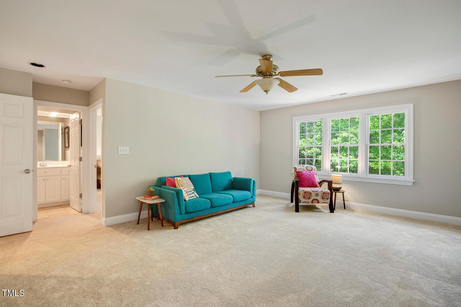 5809 Garrett Road Durham, NC 27707 - Photo 37 of 66 a living room with furniture and a ceiling fan