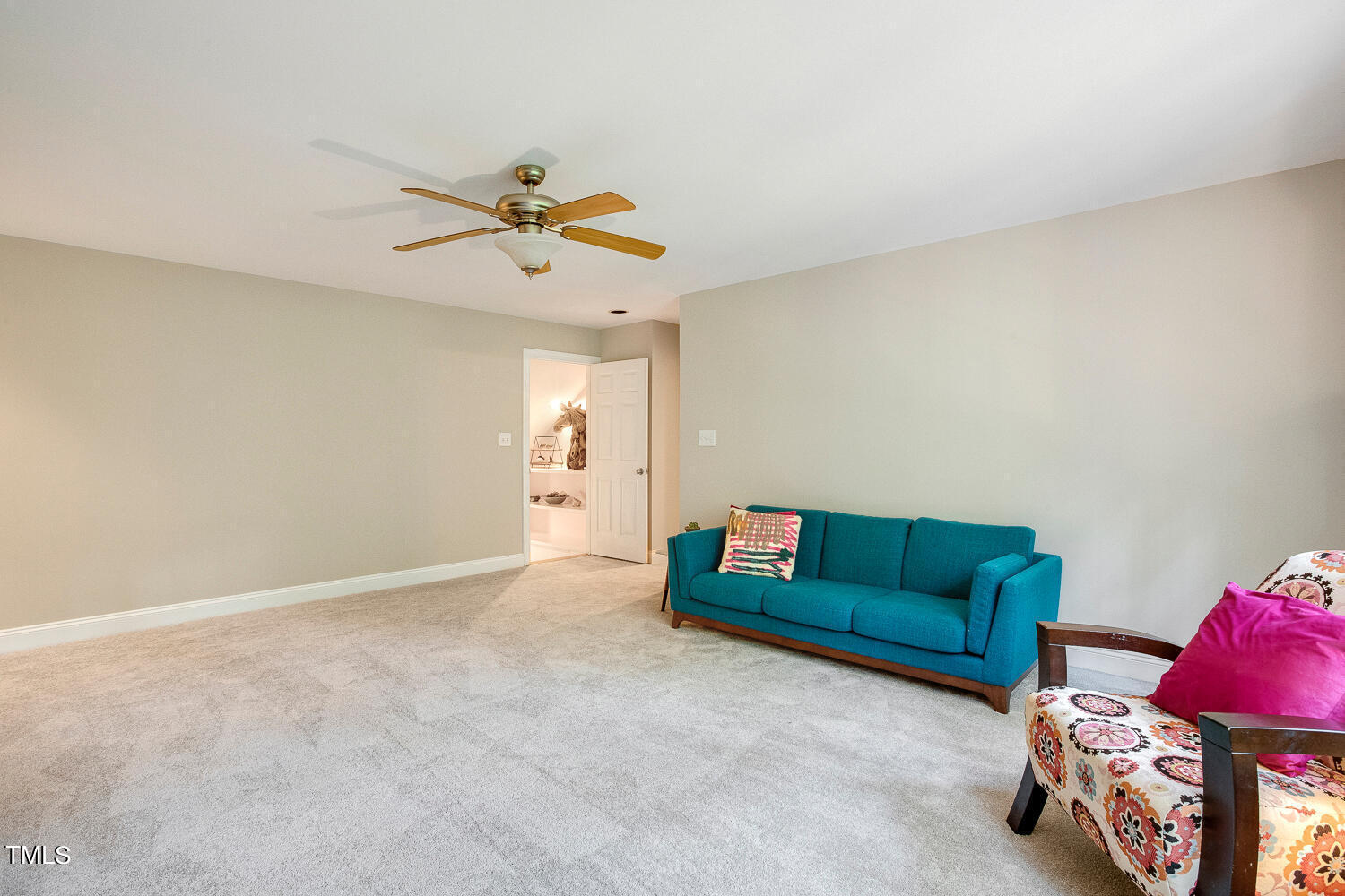 5809 Garrett Road Durham, NC 27707 - Photo 39 of 66 a living room with furniture and a rug