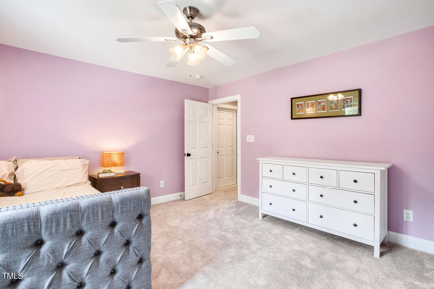 5809 Garrett Road Durham, NC 27707 - Photo 47 of 66 a bedroom with a bed and a dresser