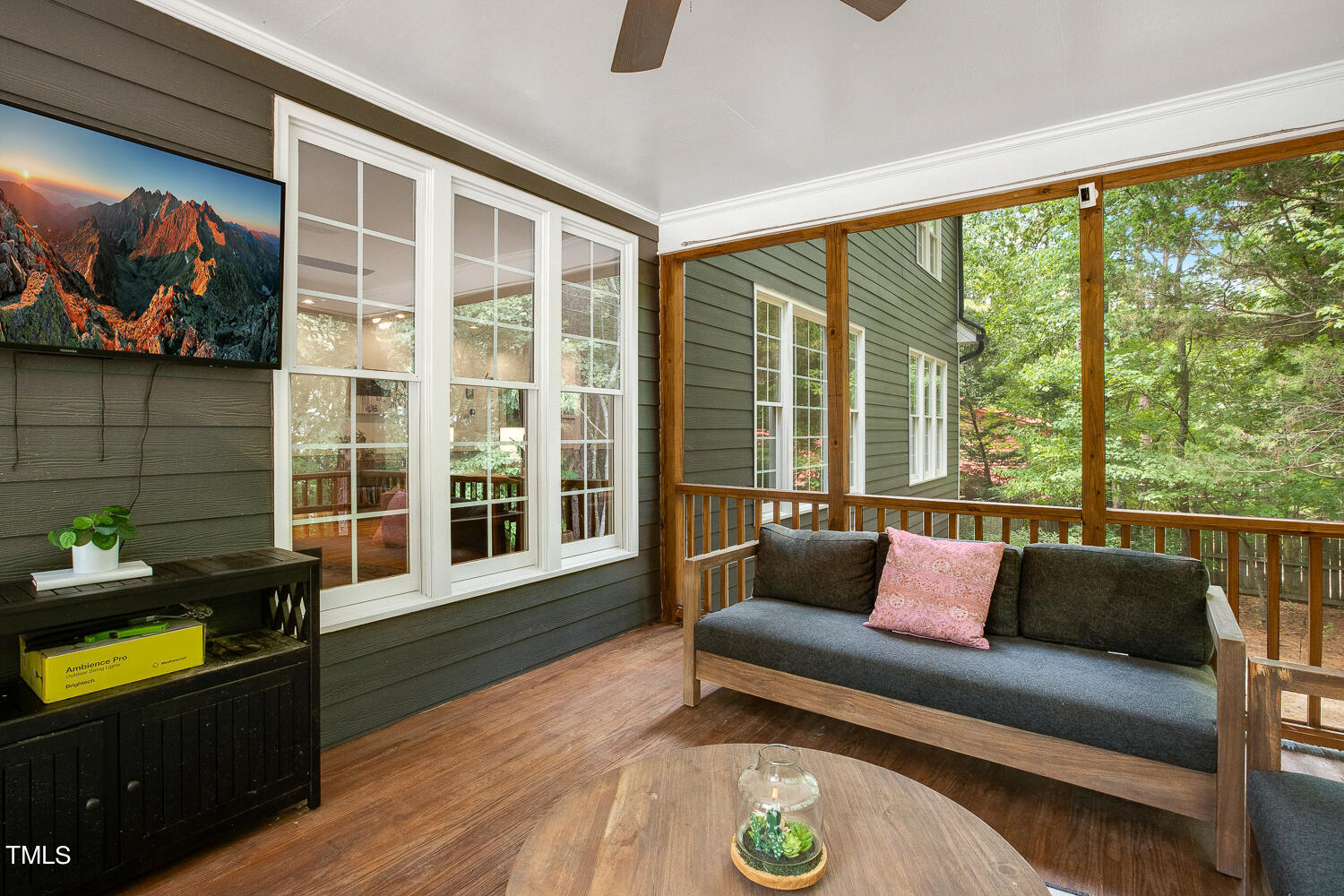 5809 Garrett Road Durham, NC 27707 - Photo 50 of 66 a living room with furniture and a flat screen tv