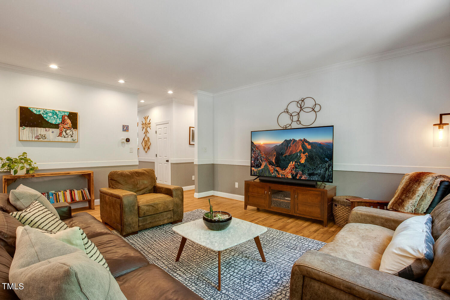 5809 Garrett Road Durham, NC 27707 - Photo 6 of 66 a living room with furniture and a flat screen tv