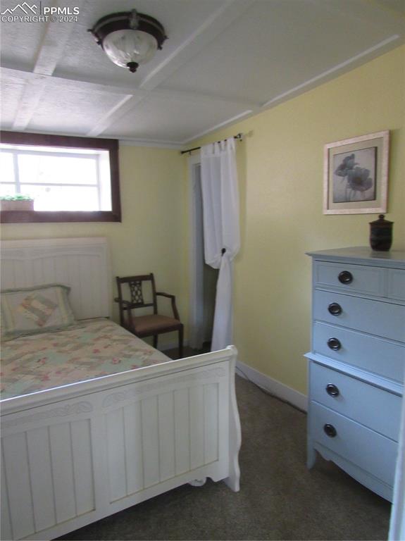 211 5th Street Victor, CO 80860 - Photo 11 of 22 a bedroom with a bed and a dresser