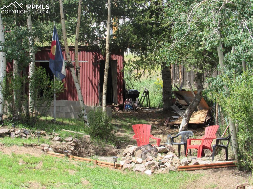 211 5th Street Victor, CO 80860 - Photo 14 of 22 a front view of house with yard