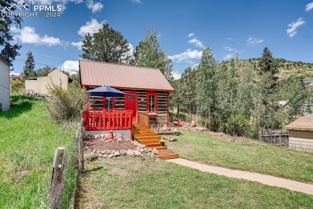 211 5th Street Victor, CO 80860 - Photo 19 of 22 a view of a house with backyard