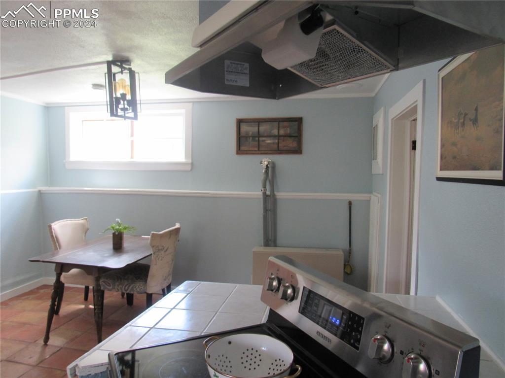 211 5th Street Victor, CO 80860 - Photo 6 of 22 a bathroom with a sink a toilet and a mirror
