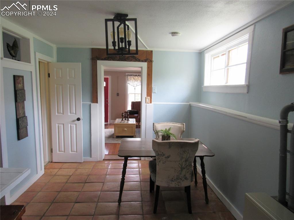 211 5th Street Victor, CO 80860 - Photo 7 of 22 a view of a dining room with furniture and window