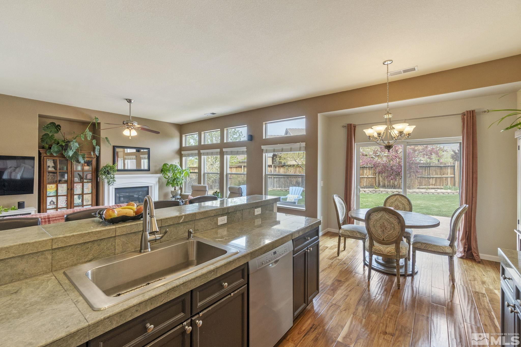 1675 Ghettis Way Reno, NV 89521 - Photo 19 of 39 a view of a kitchen with a large window and furniture