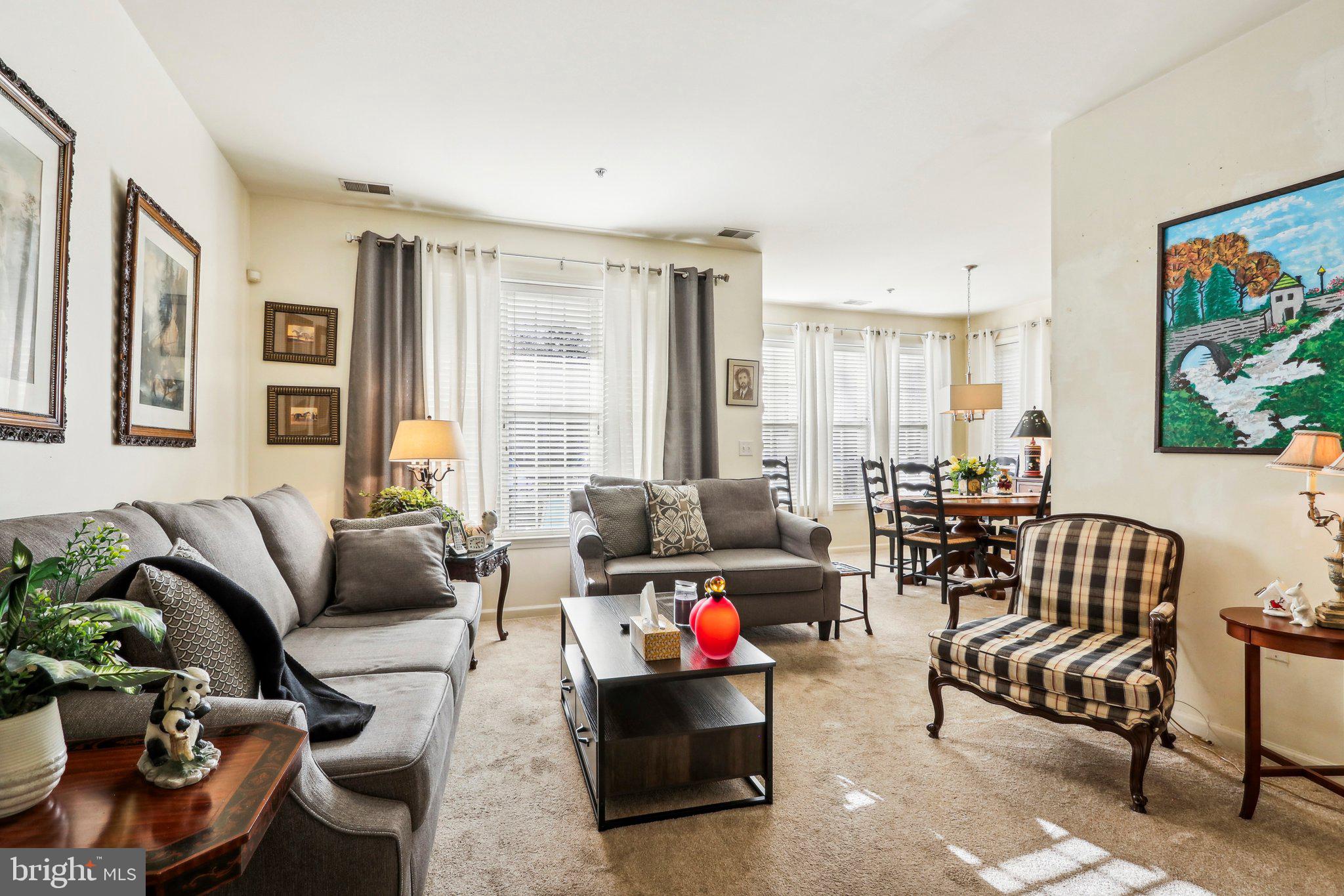 113 Kyle Way Ewing, NJ 08628 - Photo 11 of 42 a living room with furniture and a large window