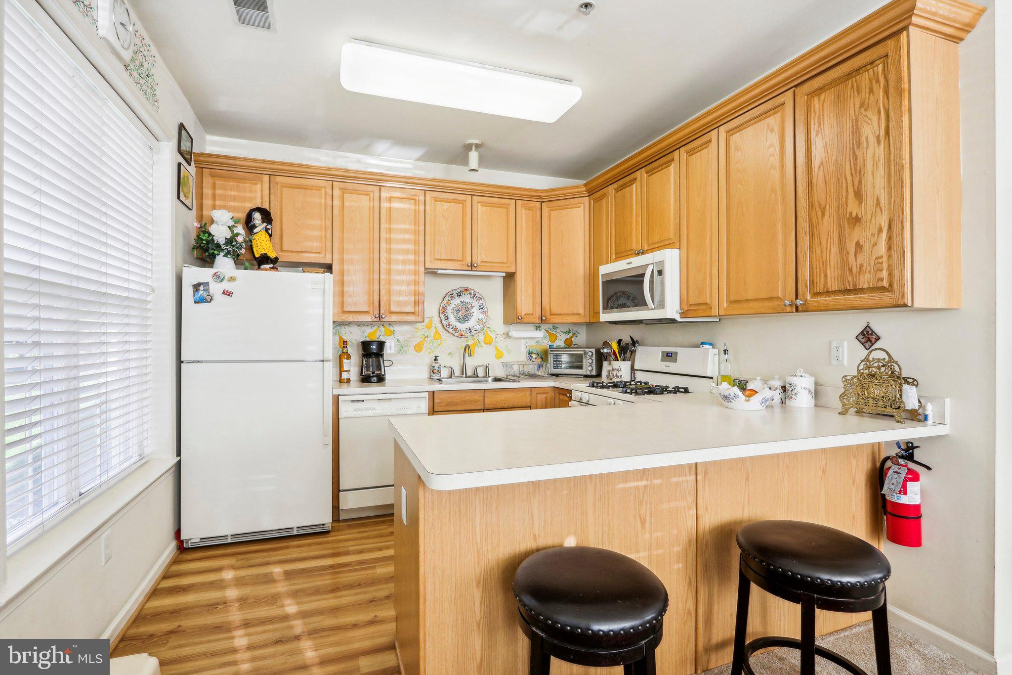 113 Kyle Way Ewing, NJ 08628 - Photo 18 of 42 a kitchen with a refrigerator and a sink