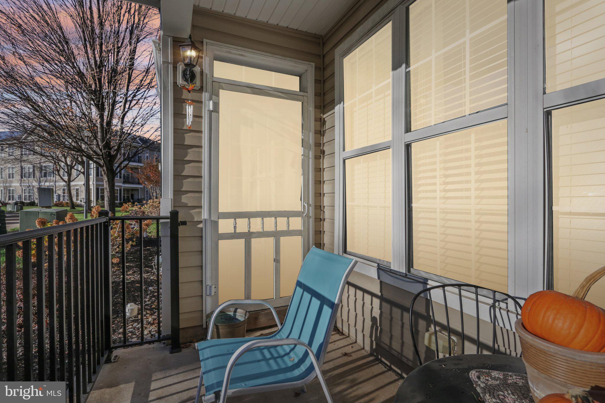 113 Kyle Way Ewing, NJ 08628 - Photo 2 of 42 a view of a chair and table in the balcony