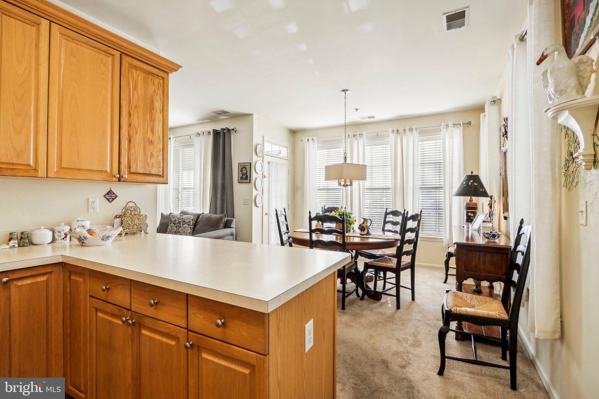 113 Kyle Way Ewing, NJ 08628 - Photo 21 of 42 a kitchen with a sink a table and chairs