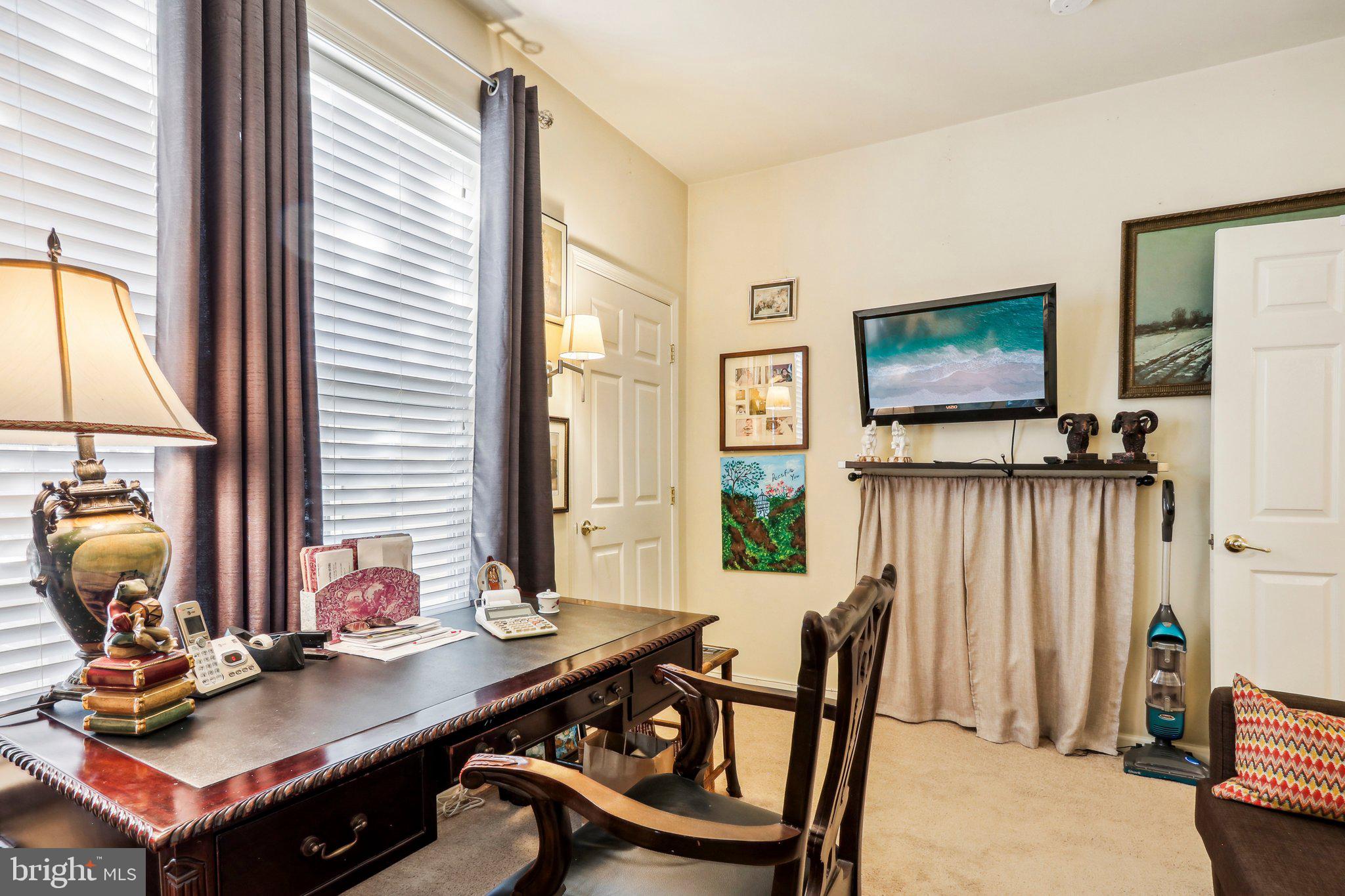 113 Kyle Way Ewing, NJ 08628 - Photo 28 of 42 a view of a workspace with furniture and a flat screen tv
