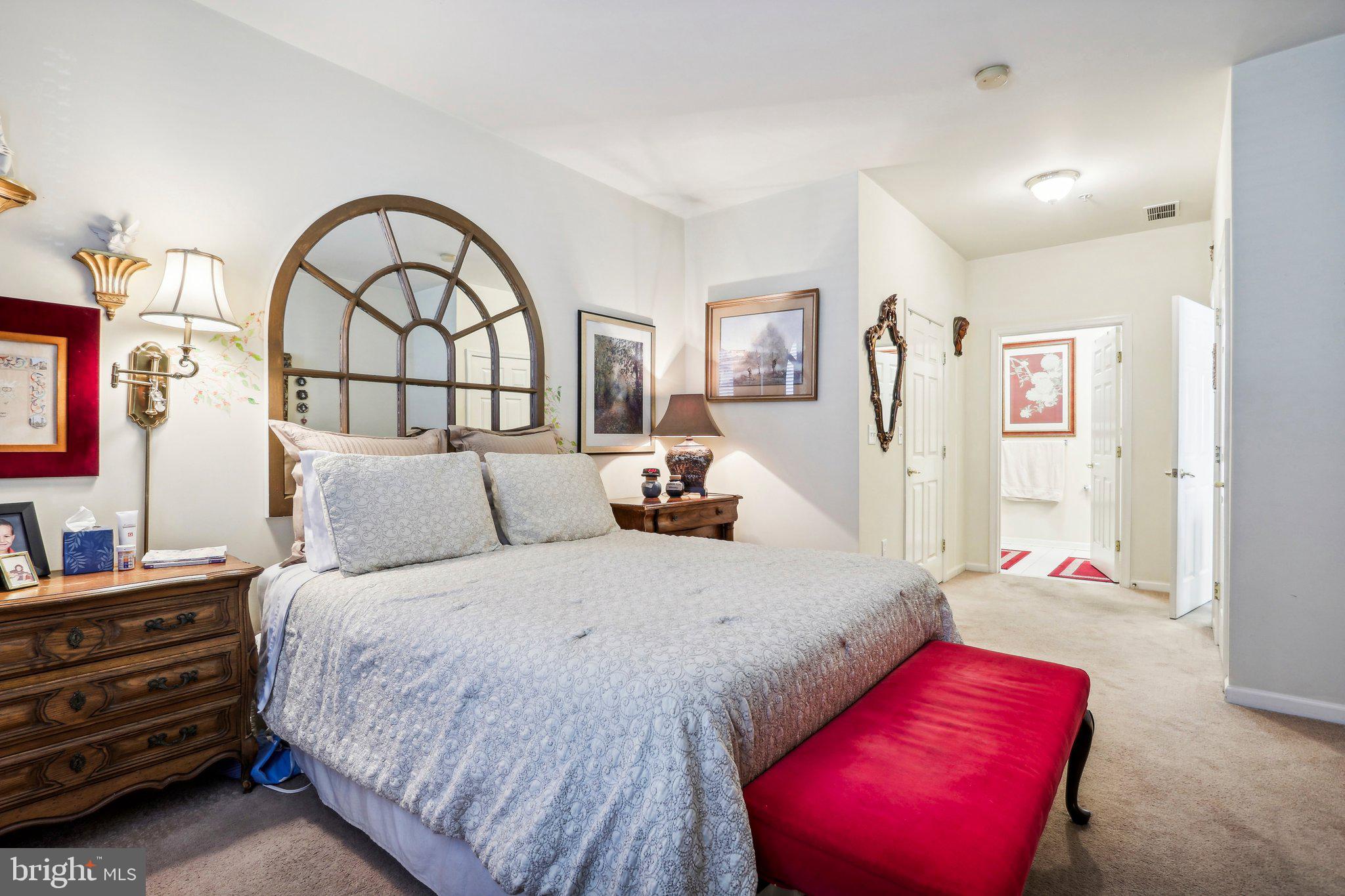 113 Kyle Way Ewing, NJ 08628 - Photo 33 of 42 a bedroom with a bed and a potted plant