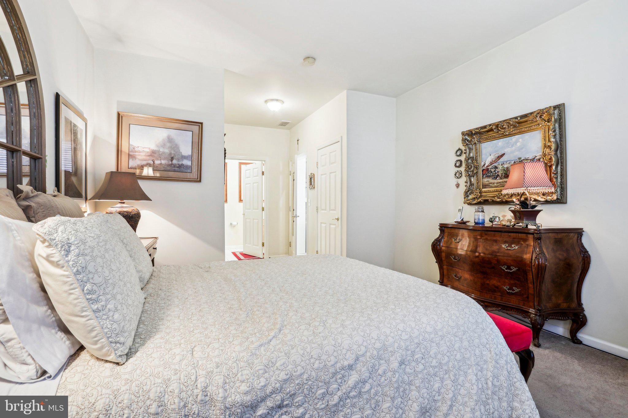 113 Kyle Way Ewing, NJ 08628 - Photo 37 of 42 a bedroom with a bed and a flat screen tv