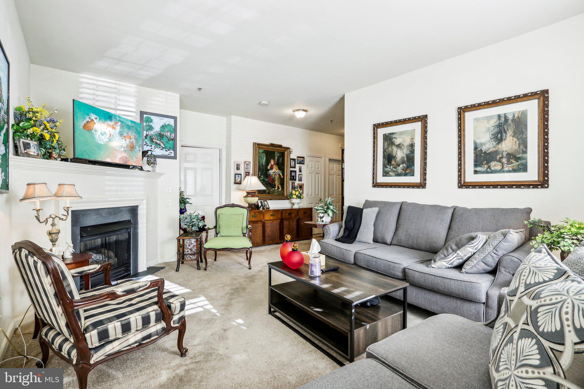 113 Kyle Way Ewing, NJ 08628 - Photo 5 of 42 a living room with furniture and a fireplace