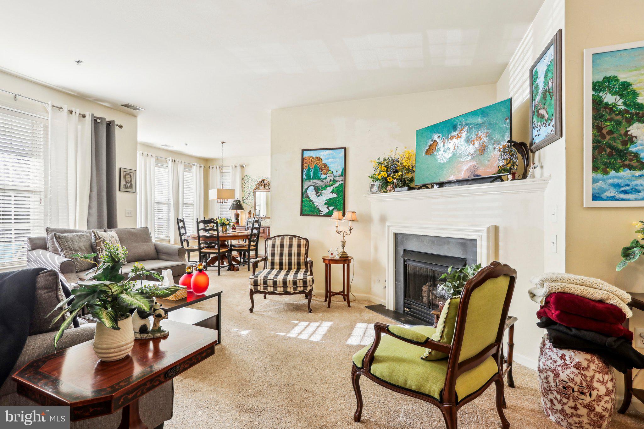 113 Kyle Way Ewing, NJ 08628 - Photo 10 of 42 a living room with furniture and a fireplace