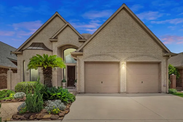 front view of house with potted plants
