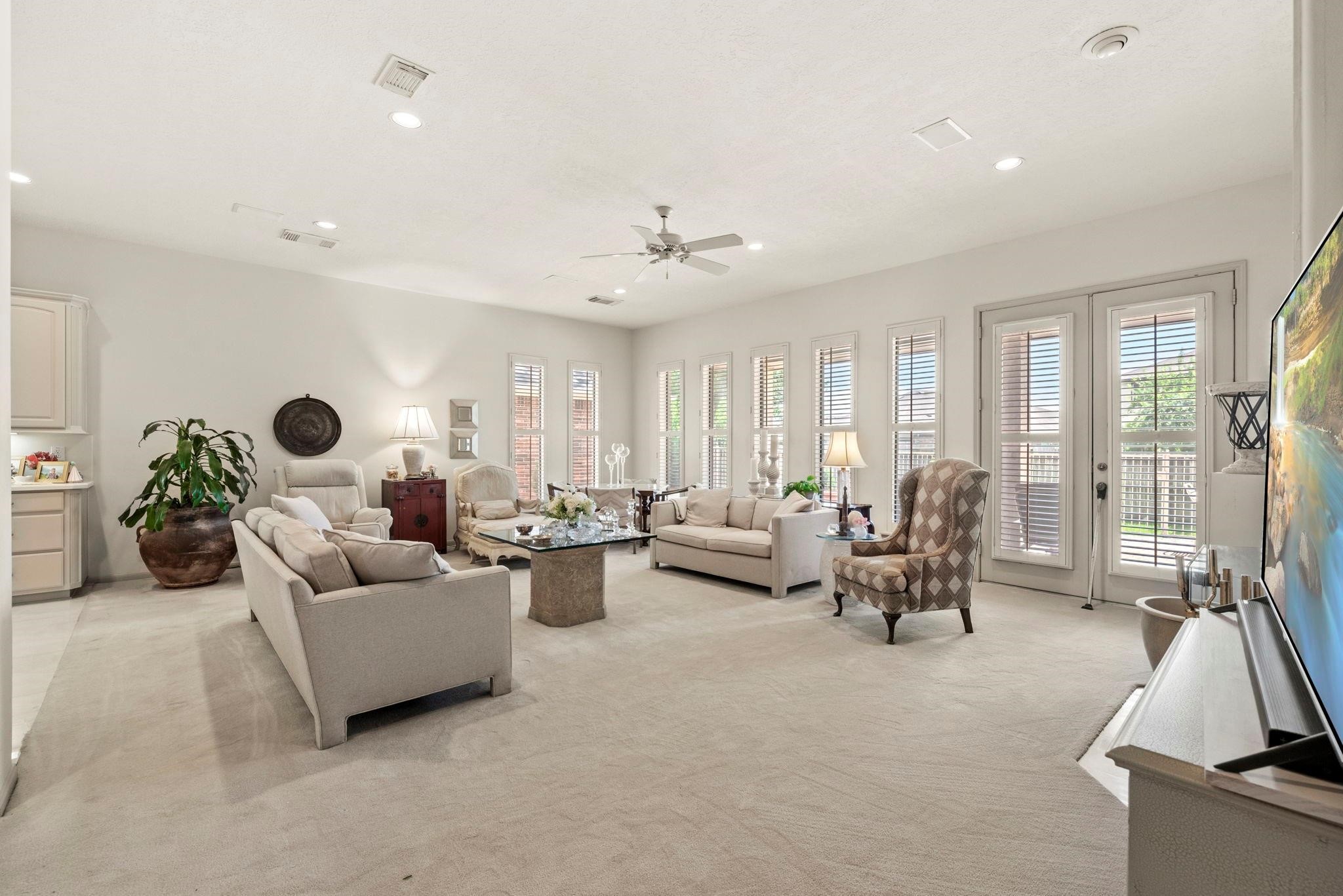 4513 Country Club View Baytown, TX 77521 - Photo 14 of 46 a living room with furniture and a flat screen tv