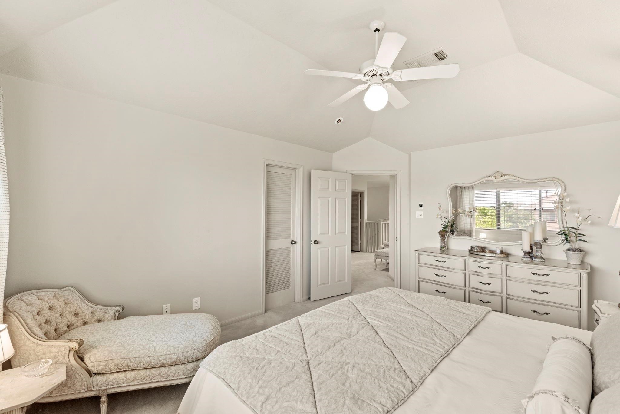 4513 Country Club View Baytown, TX 77521 - Photo 33 of 46 a bedroom with a bed and ceiling fan