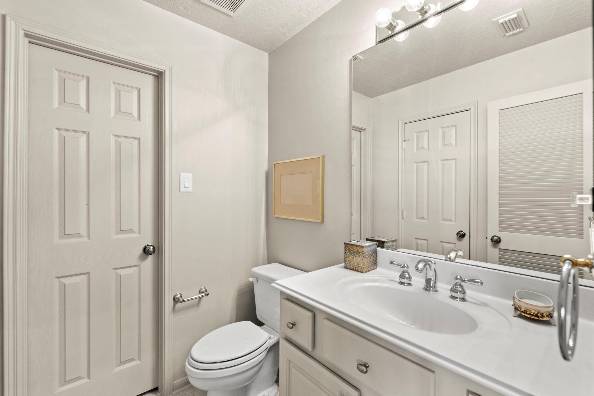 4513 Country Club View Baytown, TX 77521 - Photo 35 of 46 a bathroom with a sink a toilet and shower