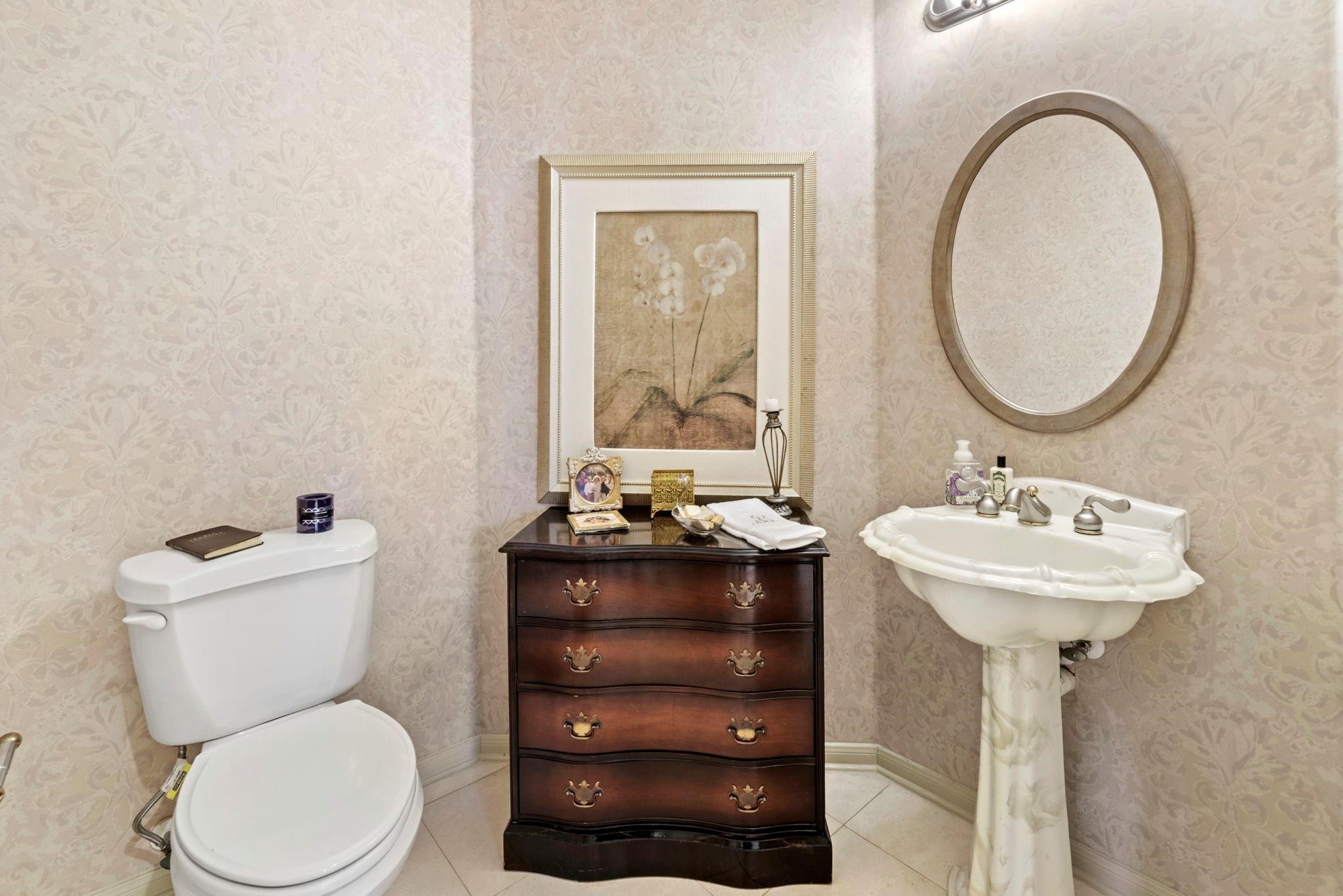 4513 Country Club View Baytown, TX 77521 - Photo 36 of 46 a bathroom with a toilet sink and mirror