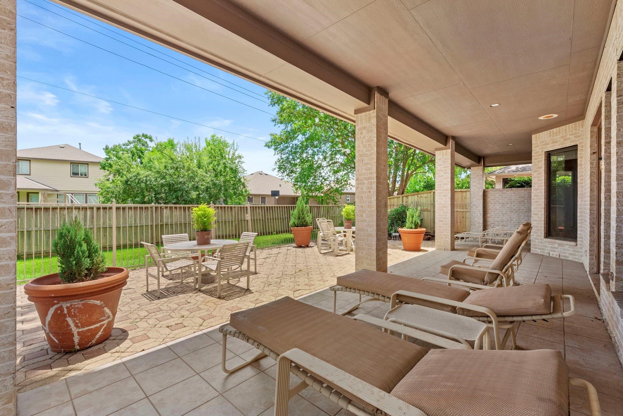 4513 Country Club View Baytown, TX 77521 - Photo 39 of 46 a view of a patio with a dining table and chairs