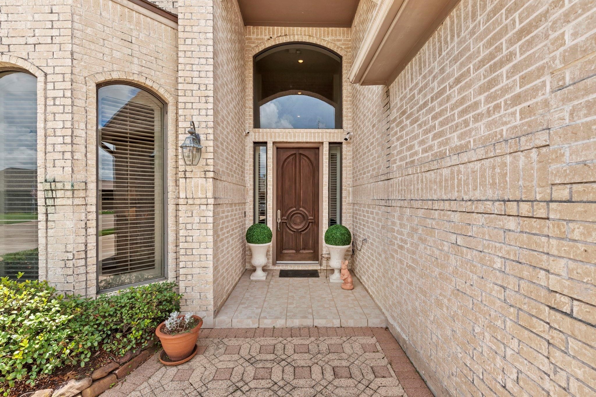 4513 Country Club View Baytown, TX 77521 - Photo 40 of 46 a view of entryway with a garden