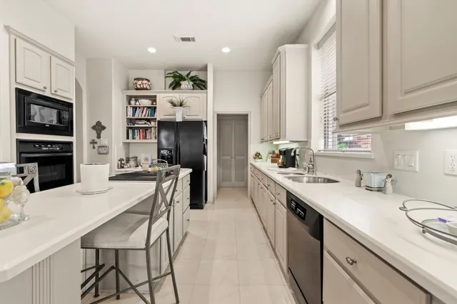 a very nice looking kitchen with cabinets