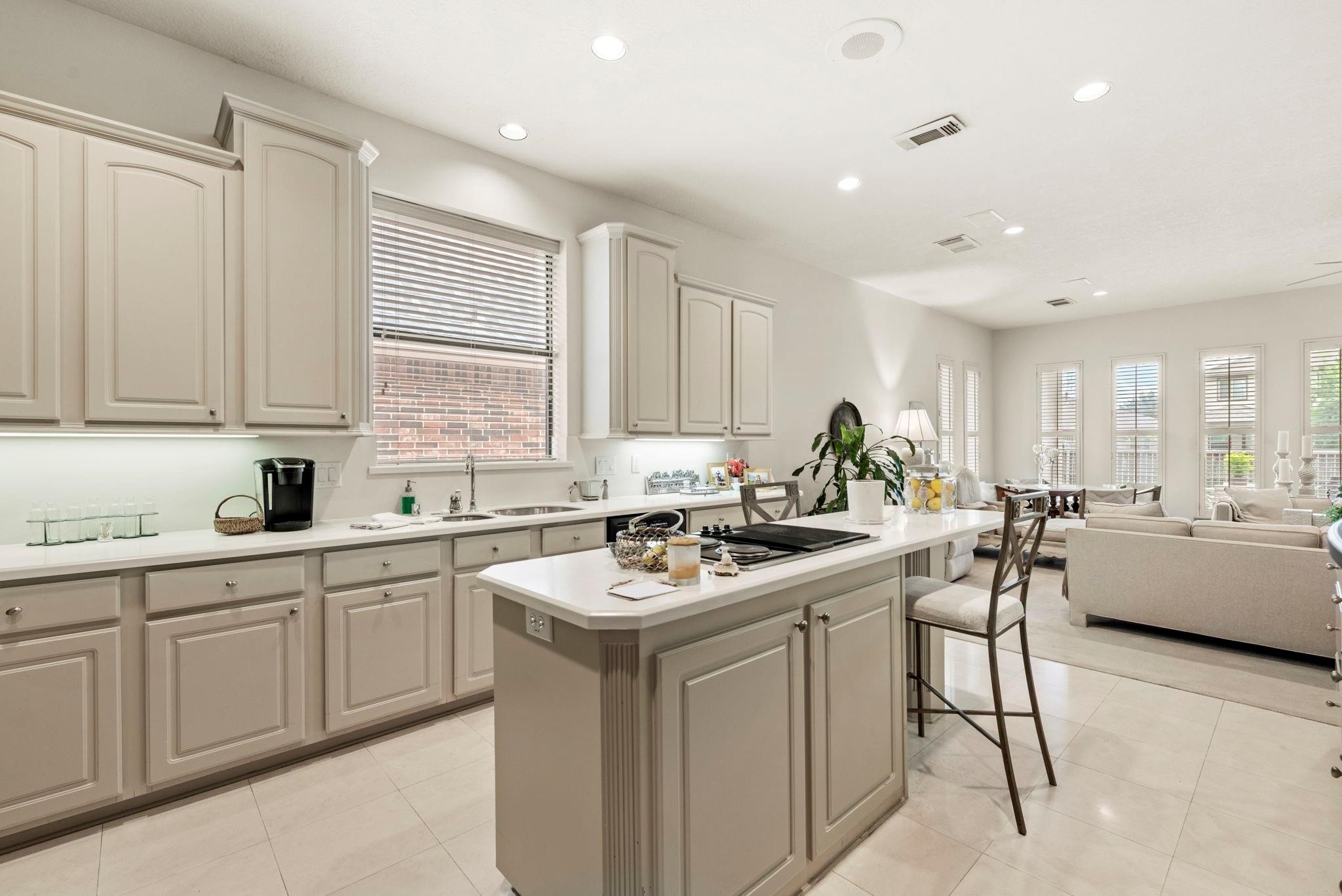 4513 Country Club View Baytown, TX 77521 - Photo 7 of 46 a kitchen with a sink stove and cabinets