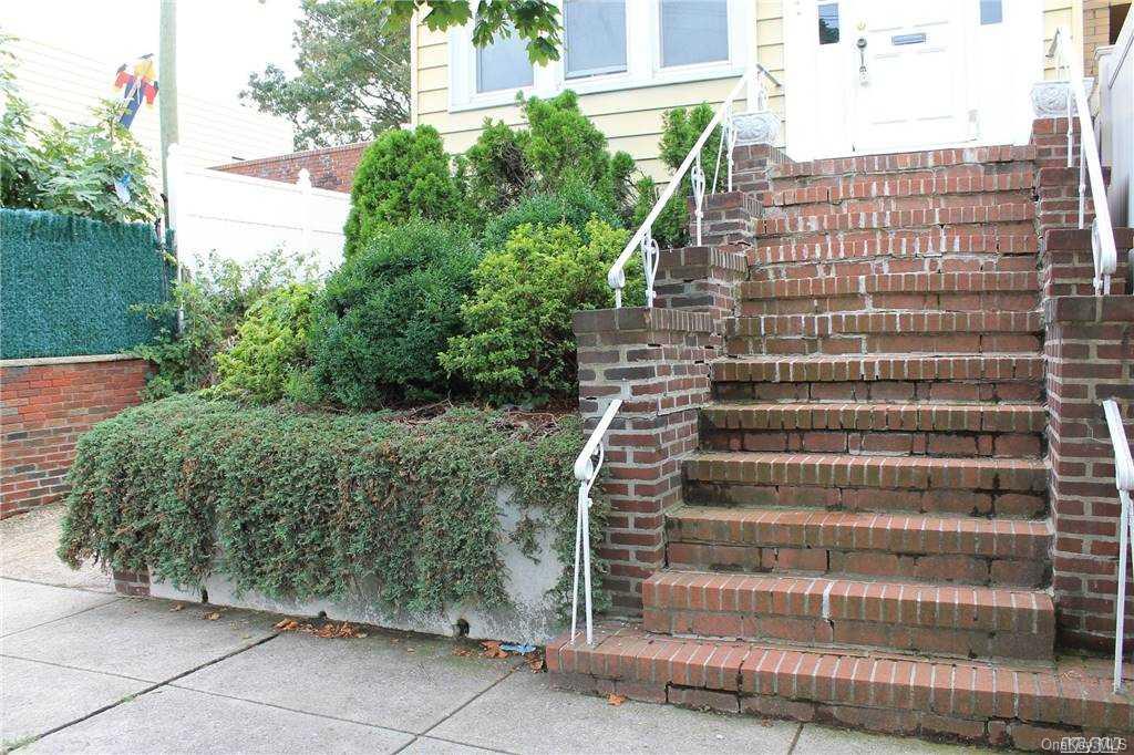 59-12 71st Street Queens, NY 11378 - Photo 2 of 26 a view of a tall building