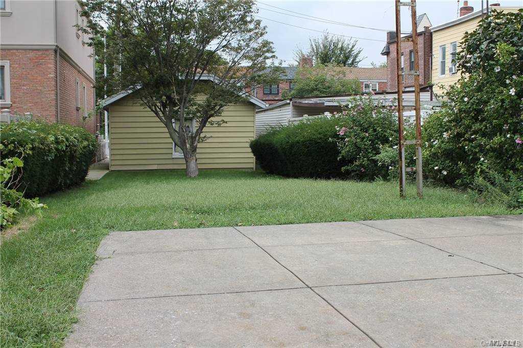 59-12 71st Street Queens, NY 11378 - Photo 5 of 26 a view of a back yard of the house