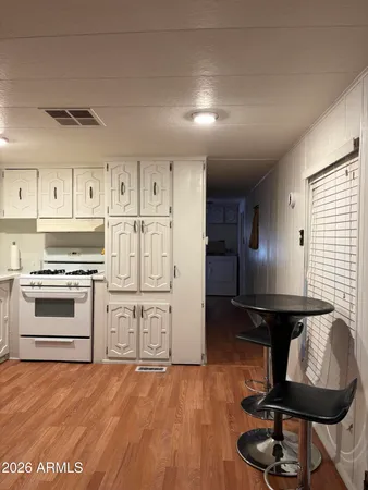 a kitchen with stainless steel appliances a sink and cabinets