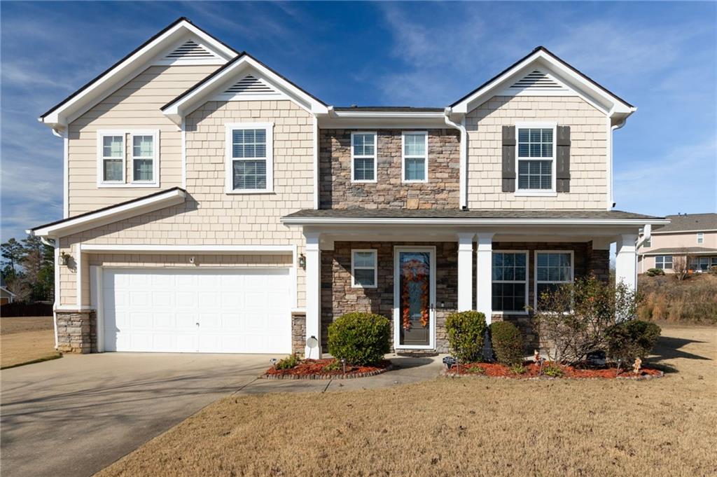 285 Waterfall Street Southwest Atlanta, GA 30331 - Photo 1 of 1 View of front of home featuring a front lawn, a porch, and a garage