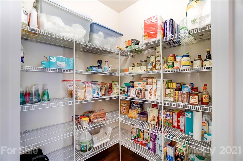 237 Butterfly Place, Unit 198 Tega Cay, SC 29708 - Photo 15 of 26 a store room with lots of different kinds of food