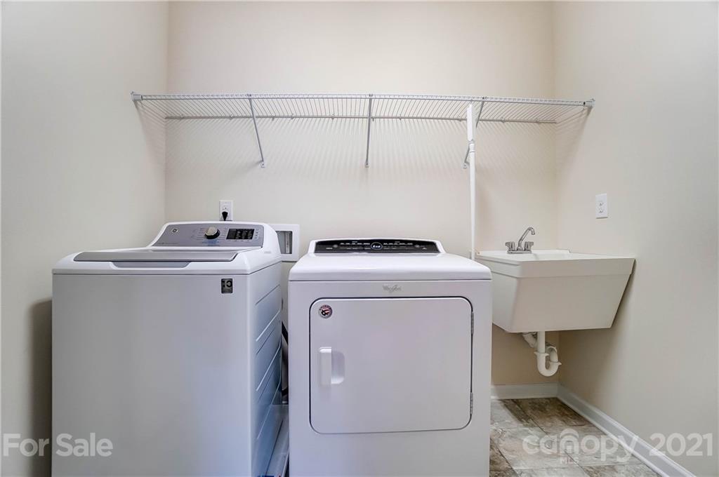 237 Butterfly Place, Unit 198 Tega Cay, SC 29708 - Photo 23 of 26 a utility room with dryer and washer