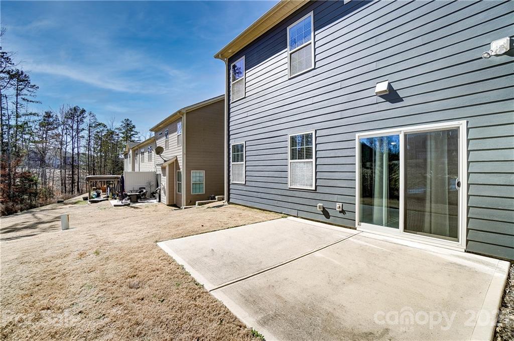 237 Butterfly Place, Unit 198 Tega Cay, SC 29708 - Photo 25 of 26 a view of a house with a patio